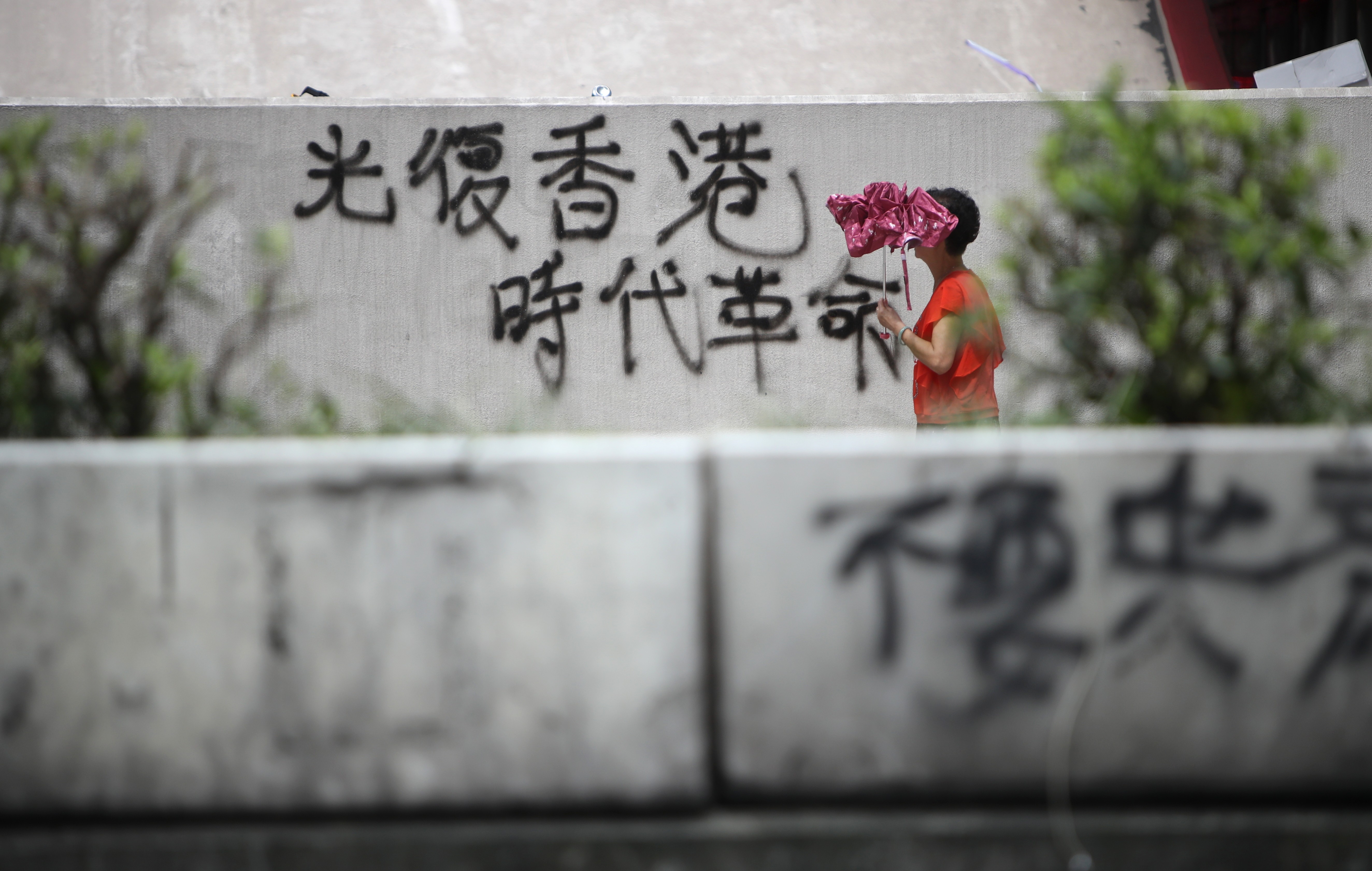 The protesters’ rallying cry of “Liberate Hong Kong; revolution of our times” is seen on August 6 spray-painted on a wall in Mong Kok. Photo: Winson Wong