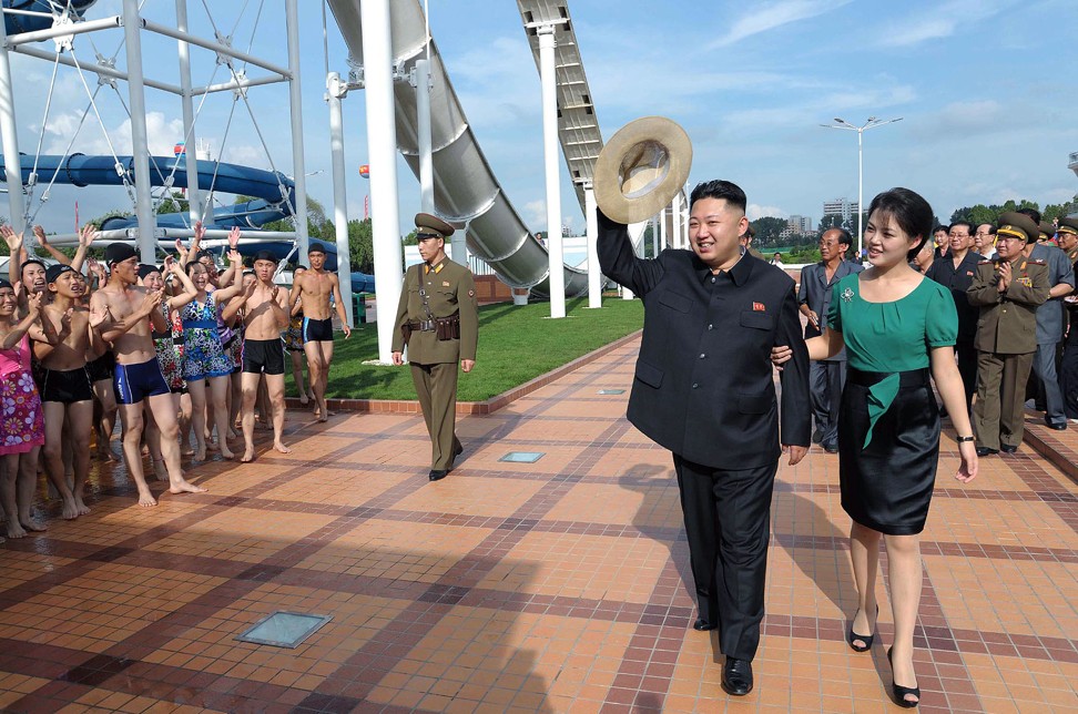 Kim and Ri visit a wading pool at the Rungna People's Pleasure Ground, in Pyongyang. Photo: AFP