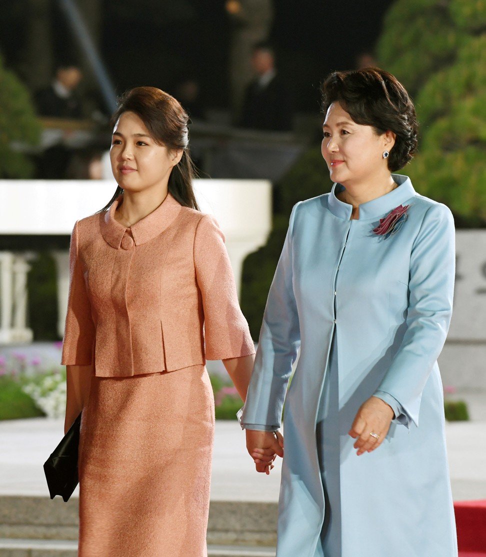 Kim Jung-sook (right), the wife of South Korean President Moon Jae-in, with Kim's wife Ri inside the demilitarised zone. Photo: Reuters