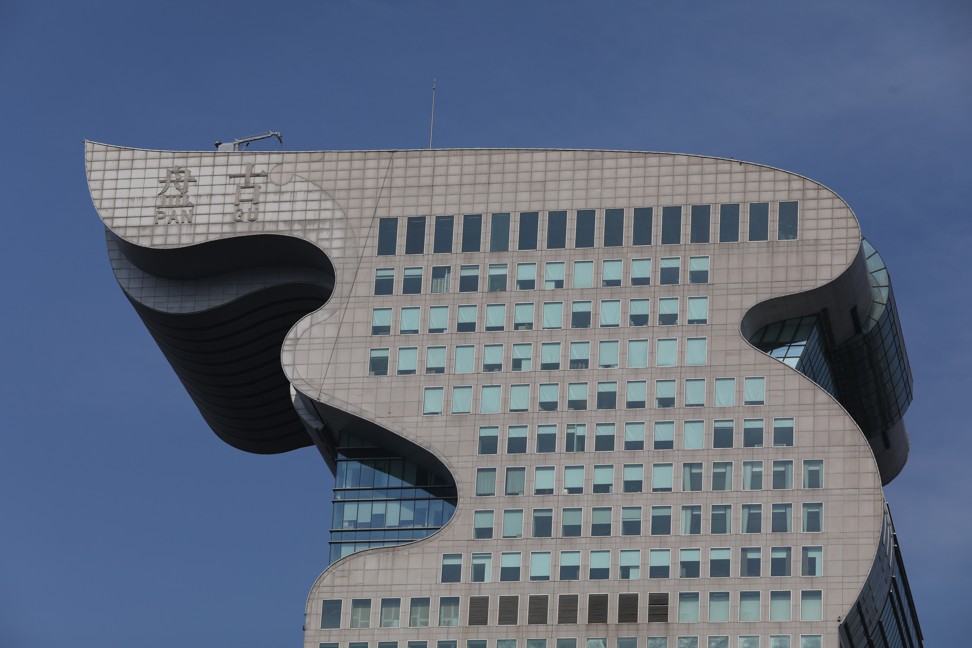 Creditors put fugitive Guo Wengui's dragon head-shaped Pangu Plaza
