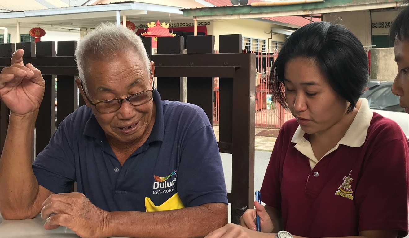 A project team member interviews a member of a village family in Kampung Cempaka. Photo: Project Community Kampung Cempaka.