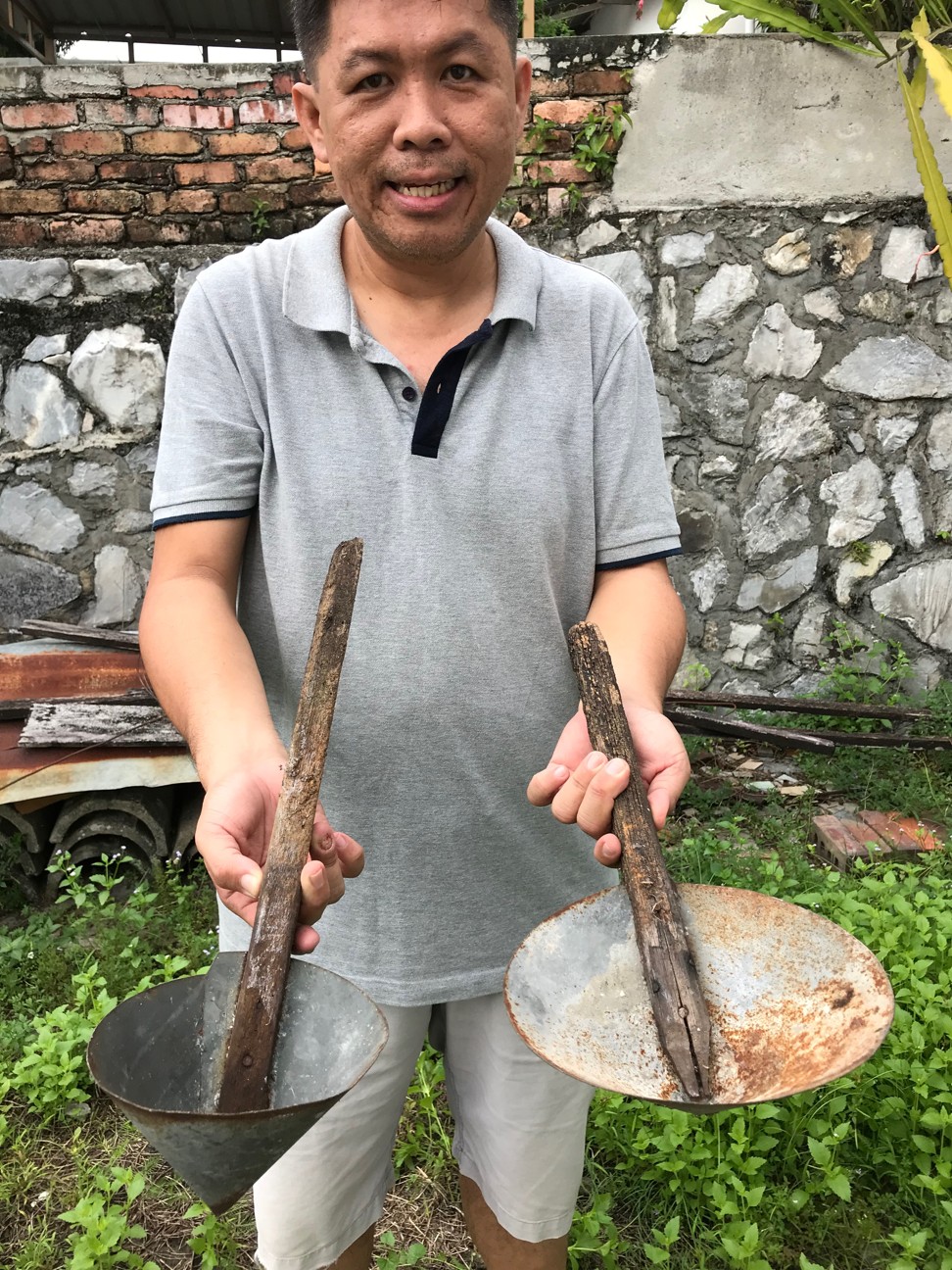 A villager in Kampung Cempaka shows tools that have been passed down in his family for generations. Photo: Project Community Kampung Cempaka
