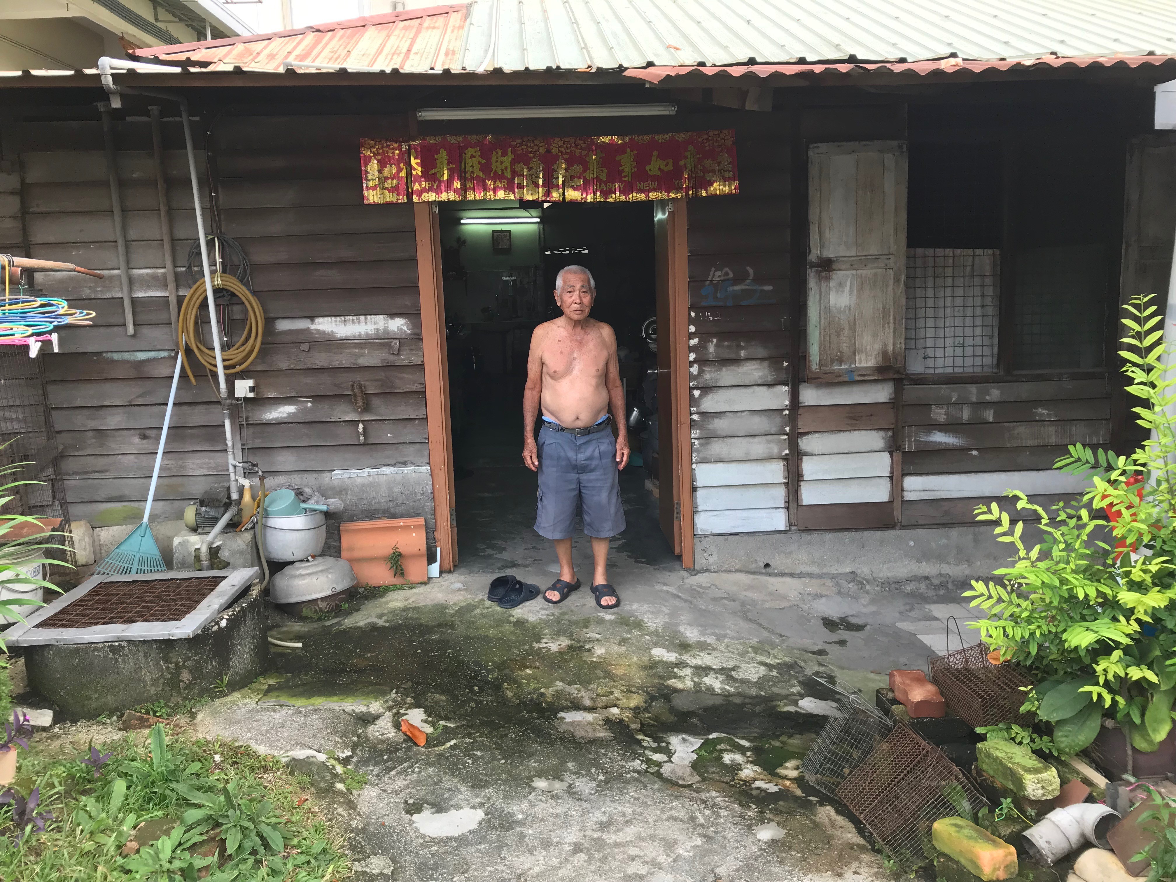 An elderly villager outside his wooden house in Kampung Cempaka, Malaysia. Photo: Project Community Kampung Cempaka