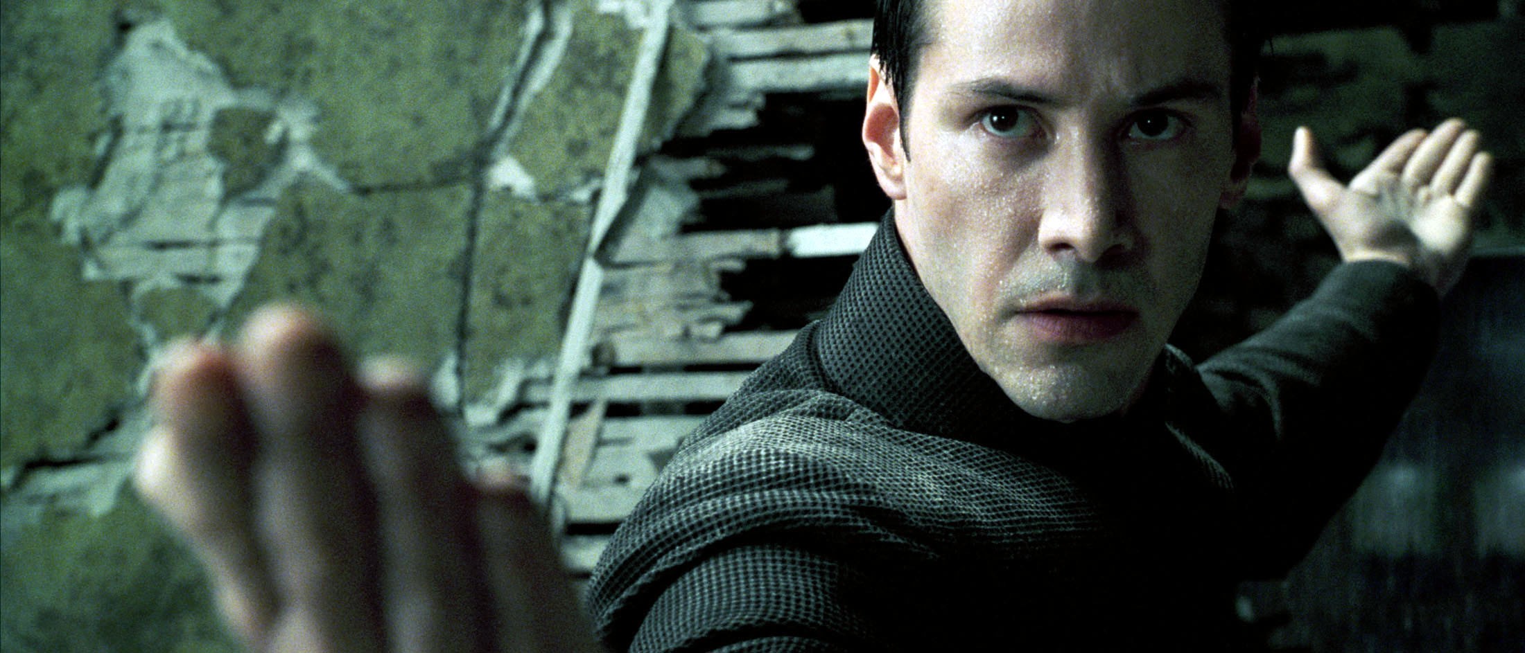 Keanu Reeves in a scene from The Matrix Revolutions (2003), the third film in The Matrix series, and the first film to be released simultaneously around the world at the same hour. Photo: Reuters/Warner Bros.