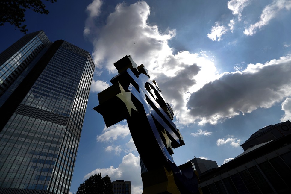Dark clouds loom for the euro, a sculpture of which stands near the former ECB headquarters in Frankfurt, Germany, in April 2018. Photo: Bloomberg