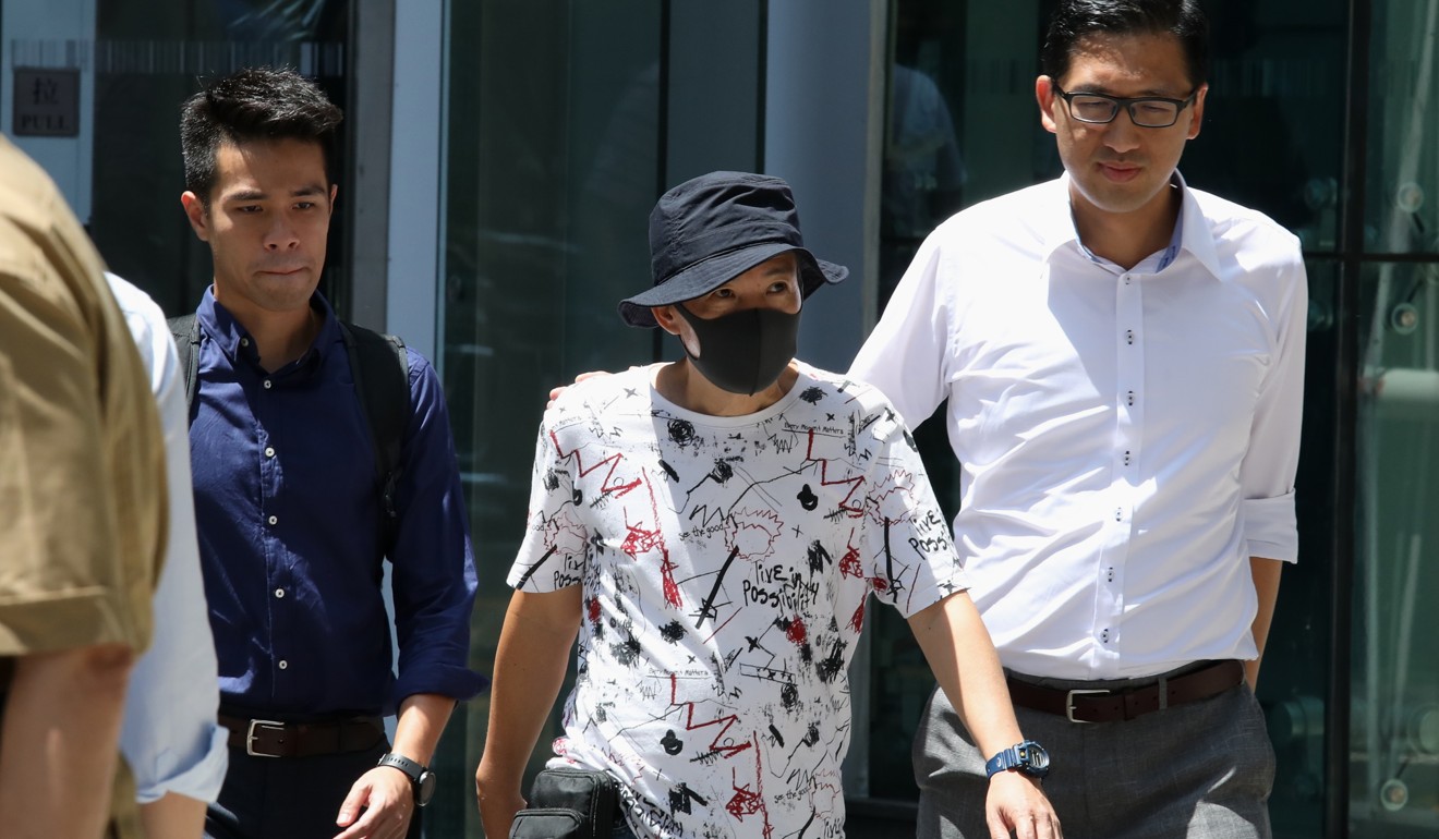 Chung Chi-wah (centre), flanked by Democratic Party community officer Edward Kwok Long-fung (left) and lawmaker Lam Cheuk-ting, leaves police headquarters in Wan Chai on Wednesday after making a formal complaint against officers. Photo: Nora Tam
