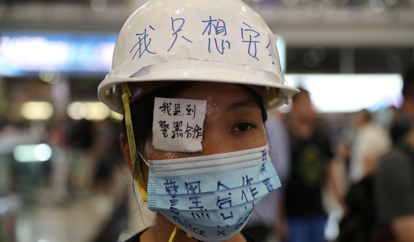 A protester at Hong Kong airport wears an eye patch in a tribute to the woman who suffered the eye injury in Tsim Sha Tsui. Photo: Sam Tsang