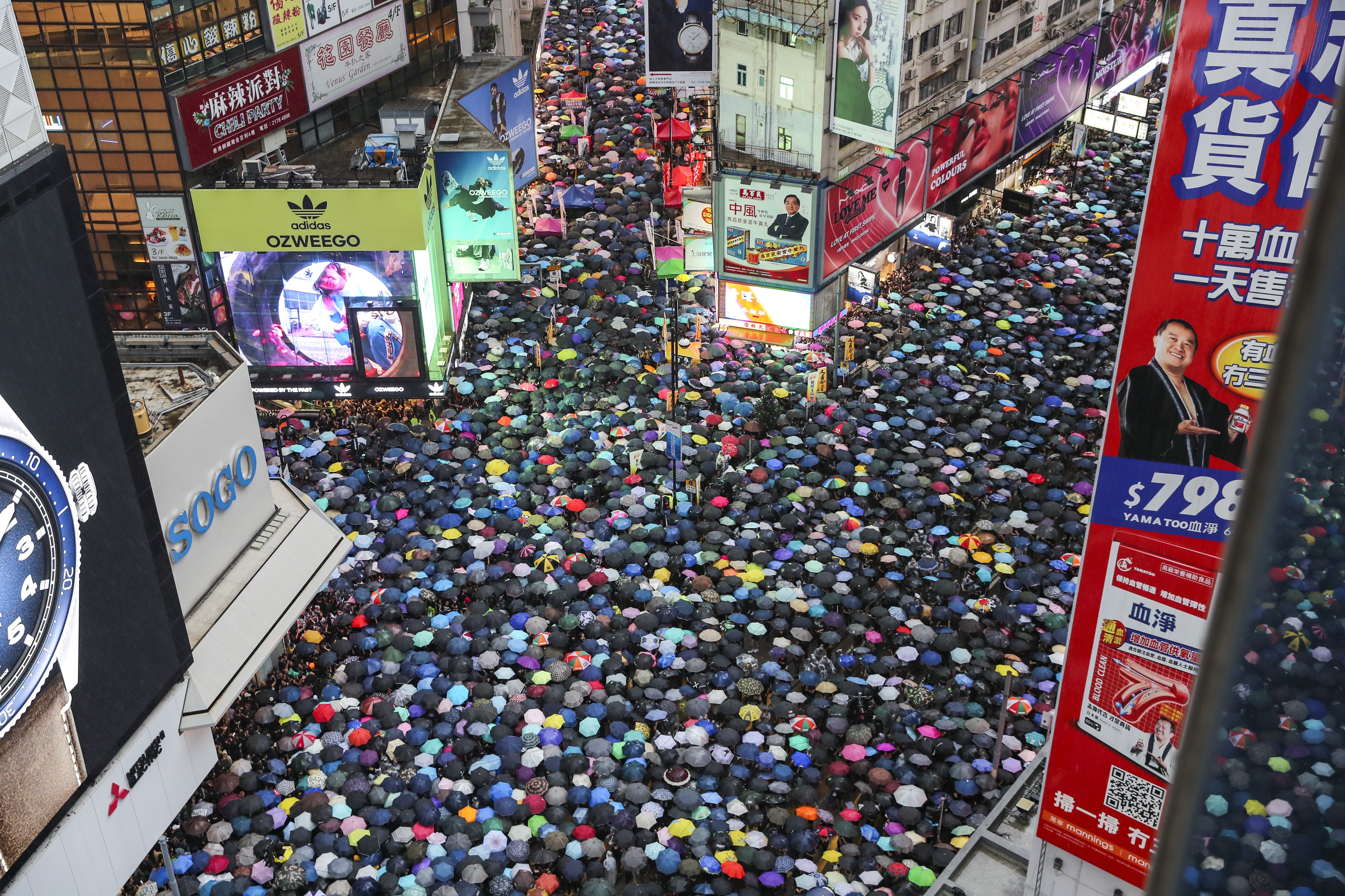 Hong Kong protesters fill the streets in Causeway Bay to call for an inquiry into police conduct during the protests, among other demands, during a demonstration in the rain on August 18. In Hong Kong now, is it possible to be pro-government and pro-reform? Is it possible to be a protester and a supporter of the police? The answer is yes. Photo: Sam Tsang