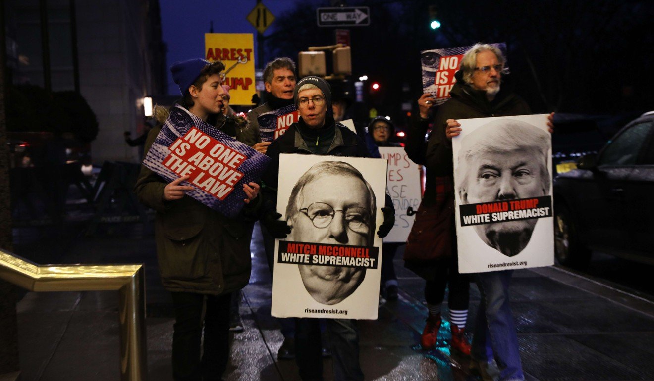 Protesters at a rally in front of the Trump International Hotel in New York City call for the impeachment of US President Donald Trump, in January this year. Photo: AFP