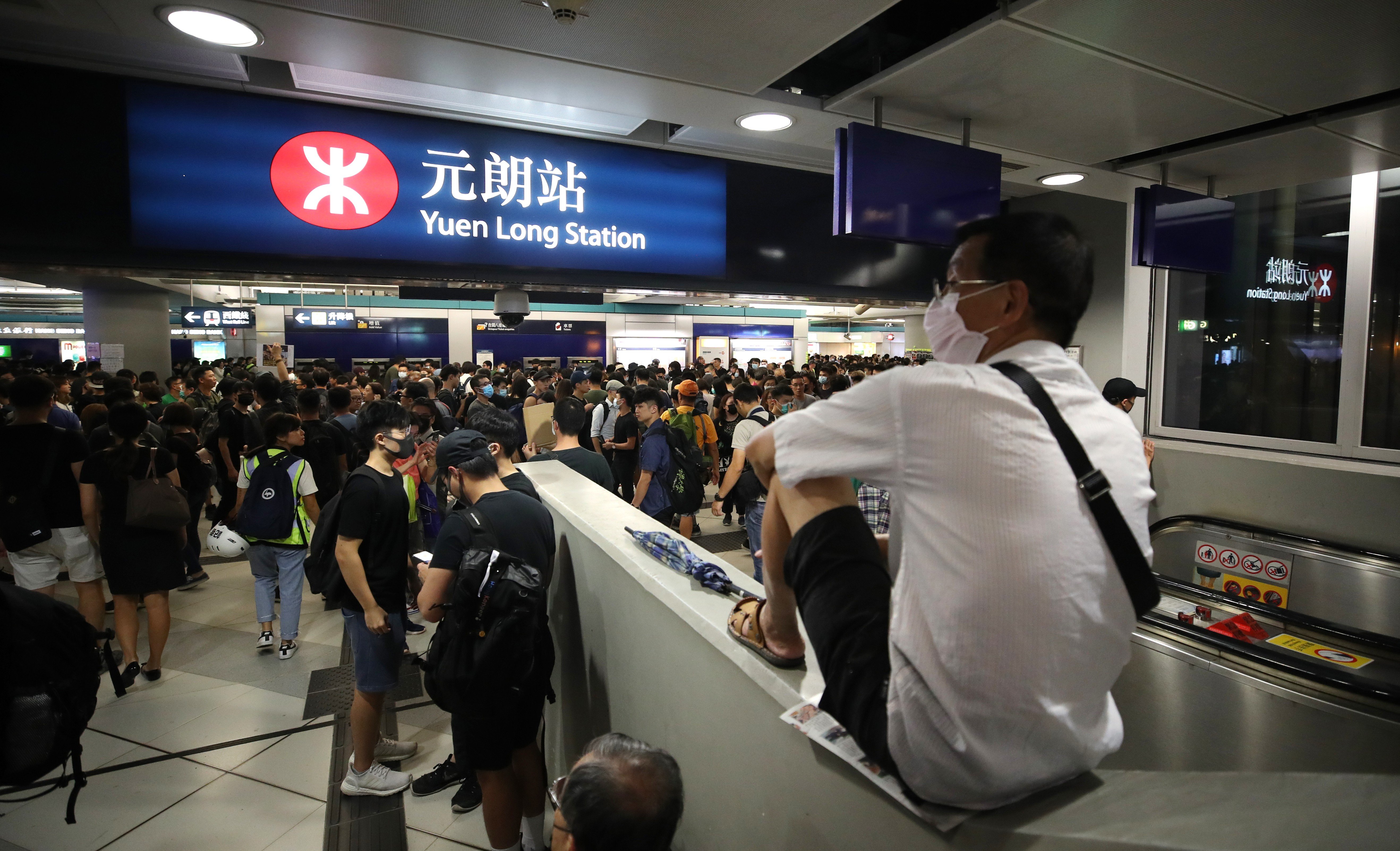 Anti-government protesters stage a sit-in at Yuen Long MTR station on Wednesday night, one month after the attack on protesters and commuters. Photo: Winson Wong