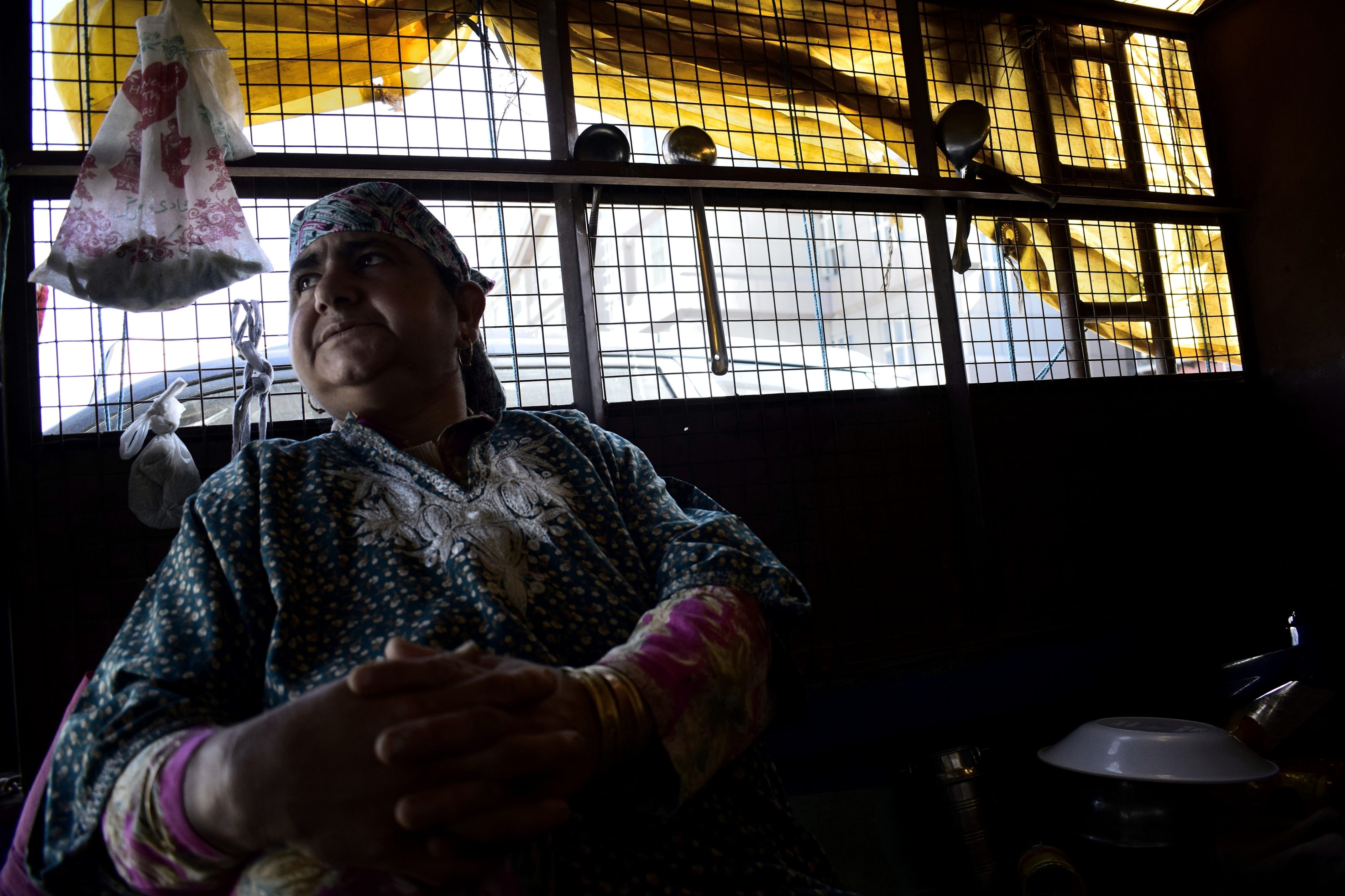 Rafiqa Manzoor’s mother sits in the truck. Photo: Sanna Irshad Mattoo