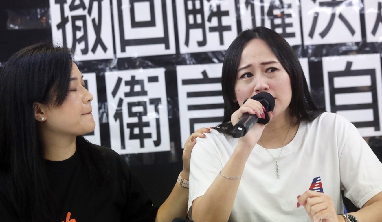 Rebecca Sy (right), with Hong Kong Confederation of Trade Unions’ chairwoman Carol Ng Man-yee, tearfully explains how she was fired. Photo: K.Y. Cheng