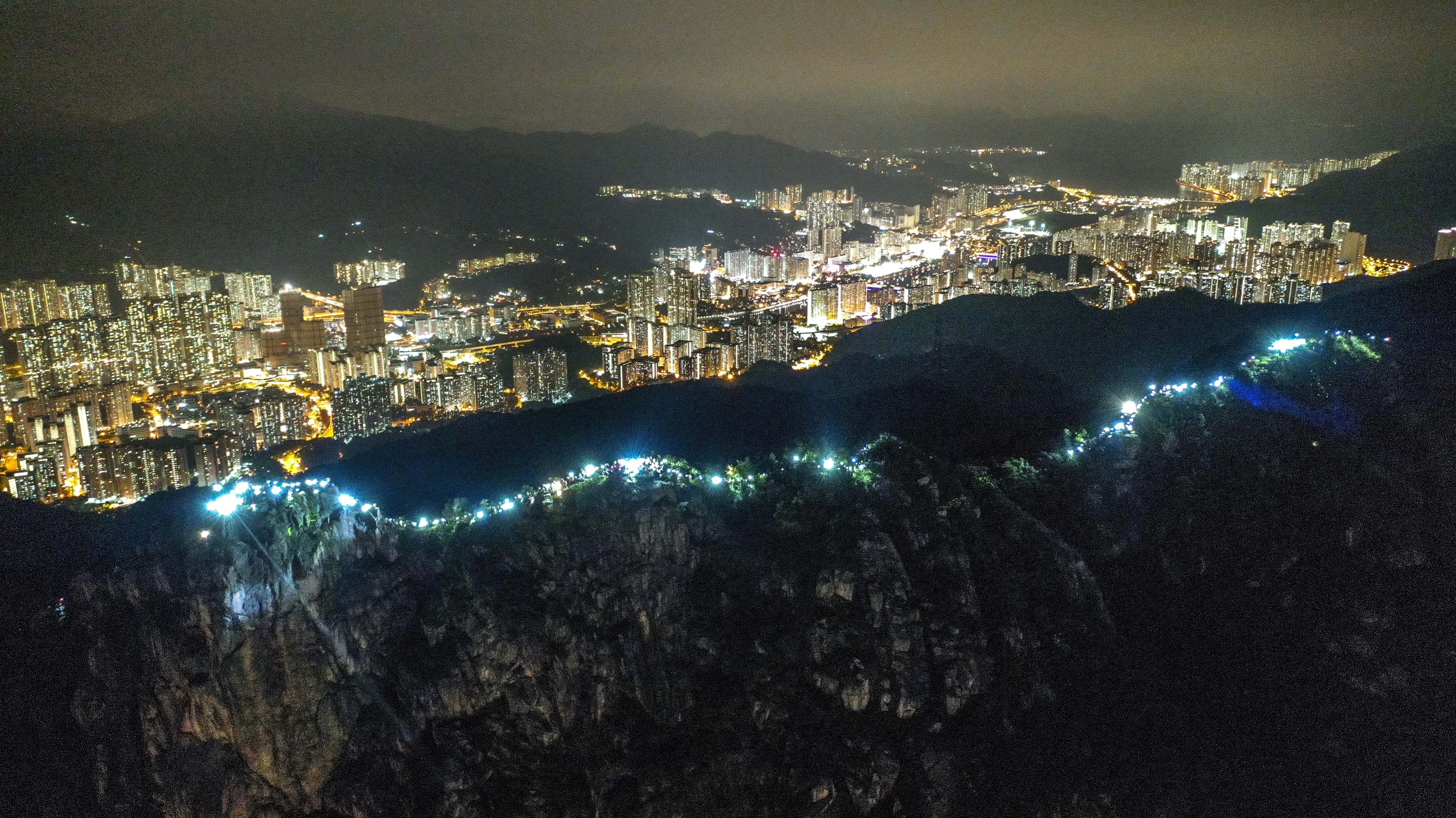 The slopes of Lion Rock were lit up on Friday with flashlights and laser pointers. Photo: Winson Wong
