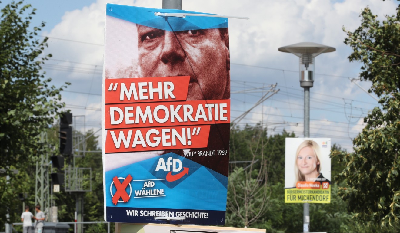 An AfD election poster reading ‘Dare more democracy’ seen in Brandenburg, Germany. Photo: EPA-EFE