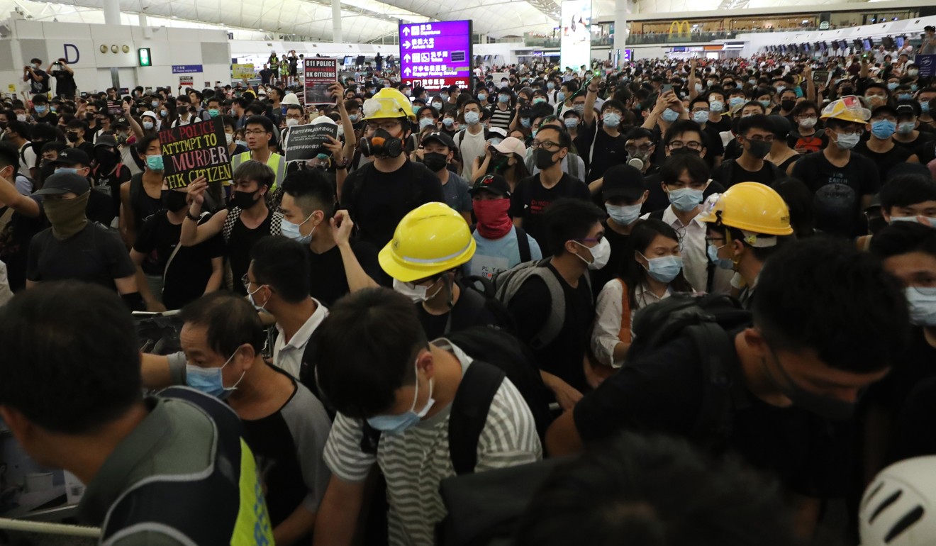 Protesters at Hong Kong International Airport on August 13. The demonstrations caused the cancellation of hundreds of flights. Photo: Sam Tsang