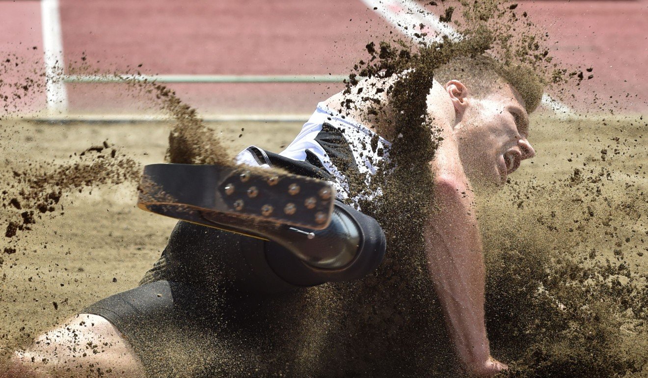 Germany’s Paralympic athlete Markus Rehm lands during a long jump demonstration in Tokyo. Photo: AFP