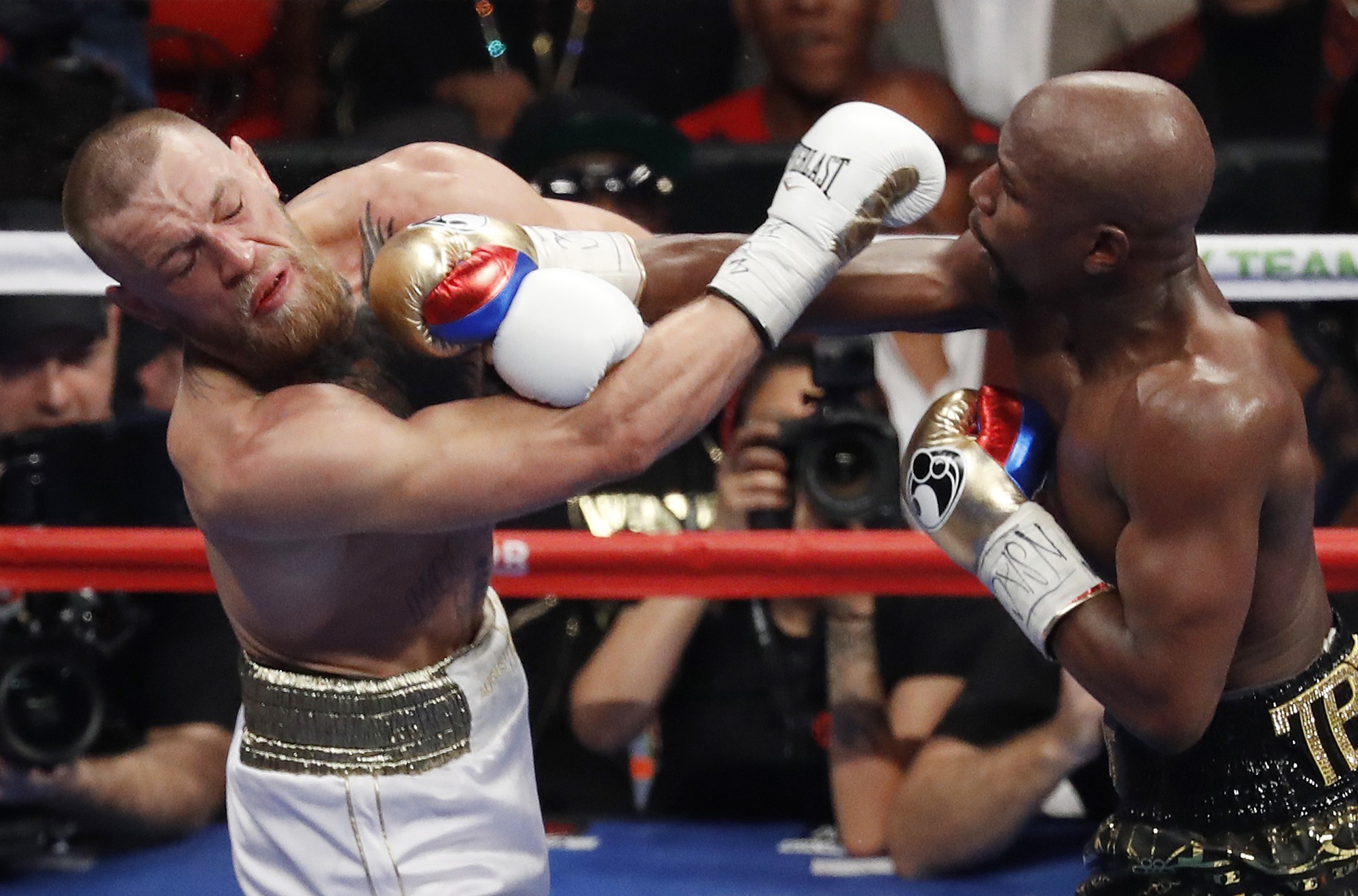 Floyd Mayweather Jnr hits Conor McGregor during their super welterweight boxing match in Las Vegas in 2017. Photo: AP