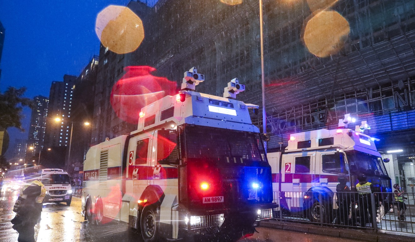 Police deployed water cannon trucks for the first time on Sunday. Photo: Dickson Lee