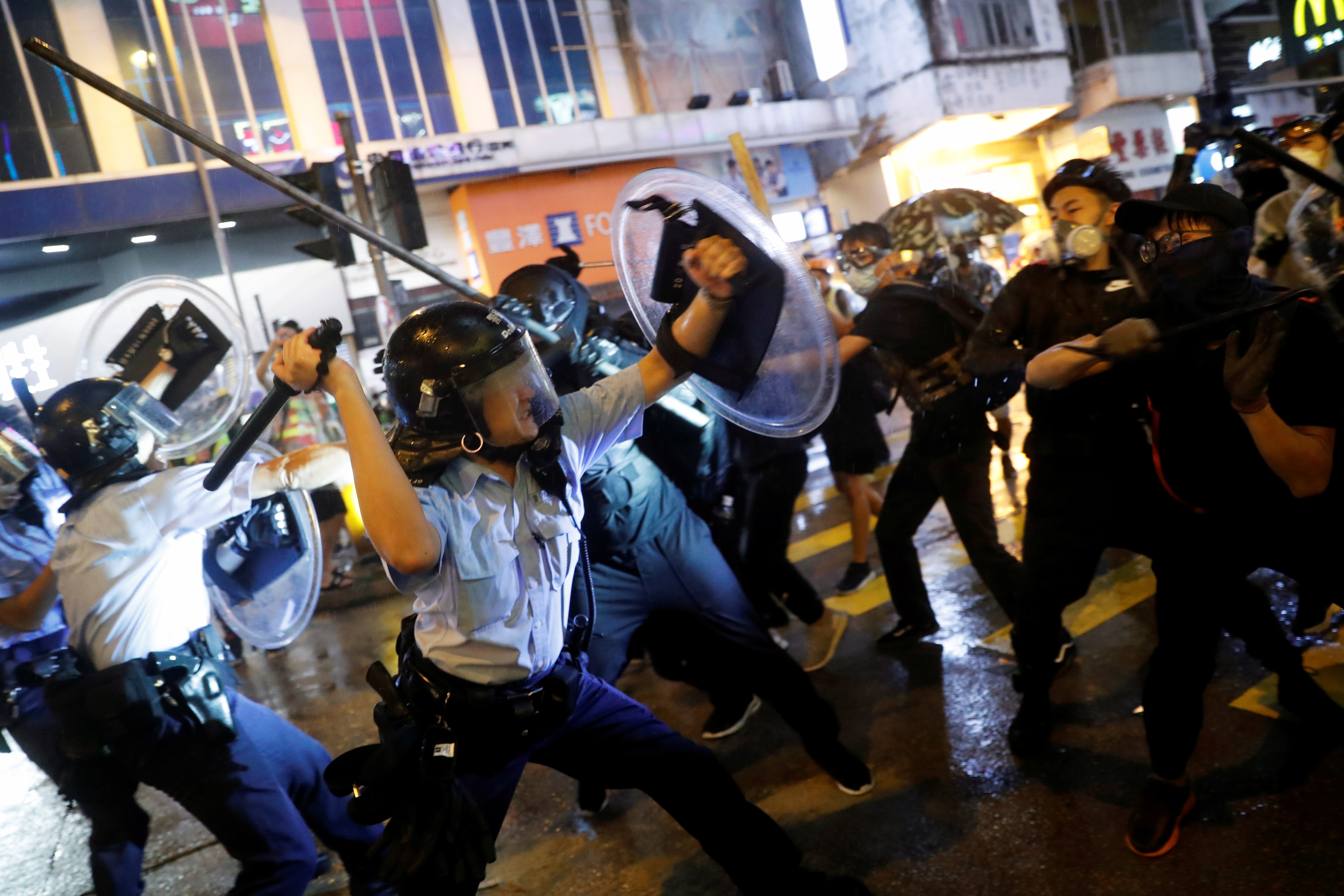 Police and protesters clash during a night of violence in Tsuen Wan, Hong Kong on Sunday night. Photo: Reuters