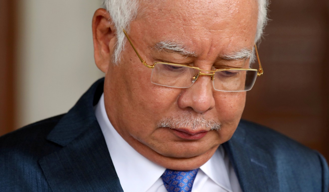 Najib Razak faces 21 charges of money laundering and four for abuse of power. Photo: Reuters