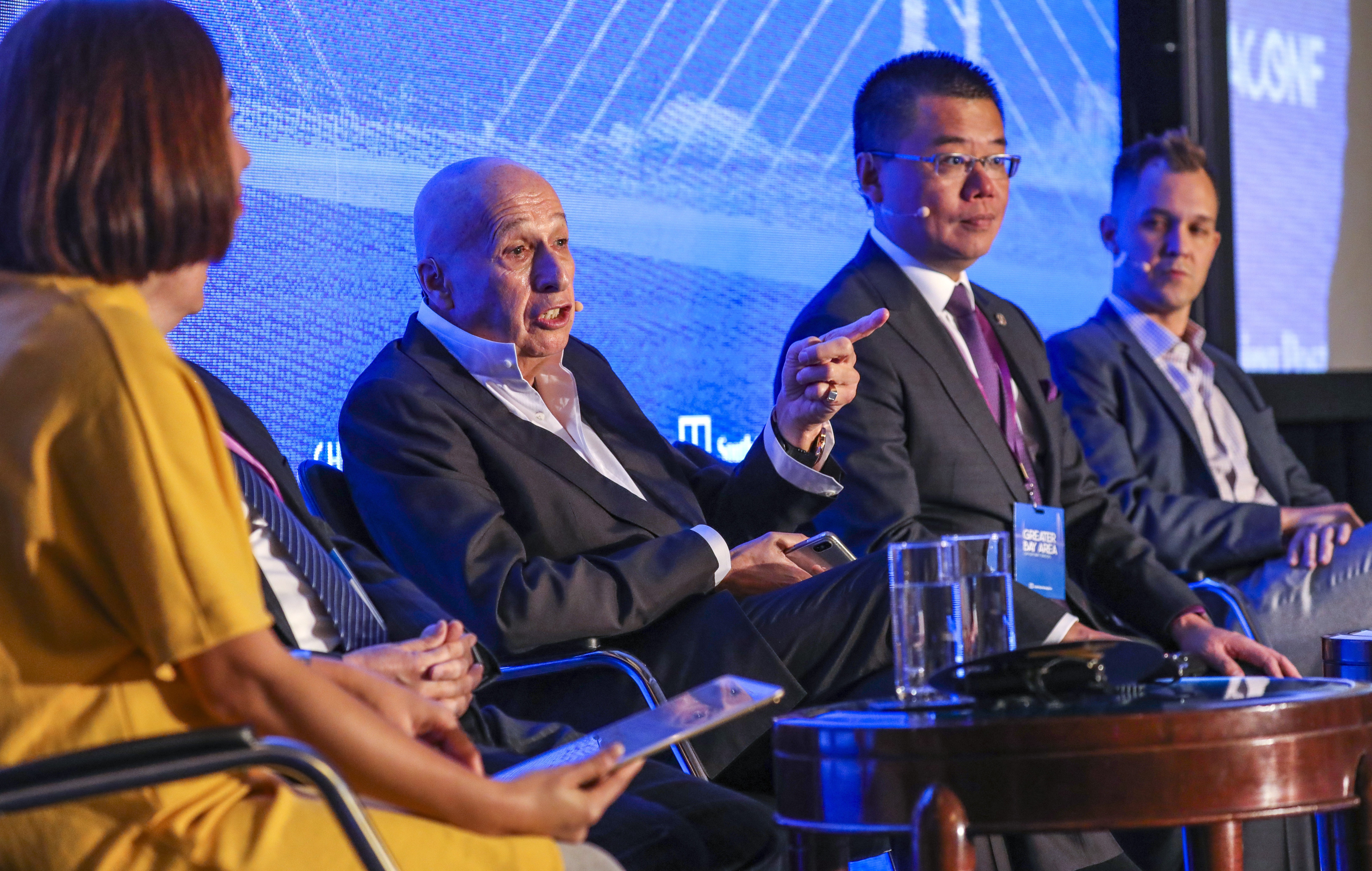 Allan Zeman (second left), chairman of Lan Kwai Fong Group, Witman Hung (second right), principal liaison officer for Hong Kong at the Shenzhen Qianhai Authority and Tony Verb (right), co-founder and partner at GreaterBay Venture & Advisors, take part in a panel discussion titled ‘The competition conundrum’, at the South China Morning Post’s China Conference, on Wednesday. Photo: May Tse