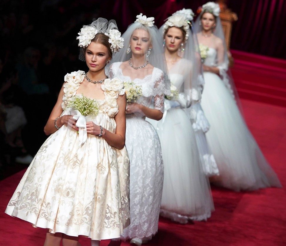 Models present creations by Dolce and Gabbana during the Milan Fashion Week. Photo: EPA