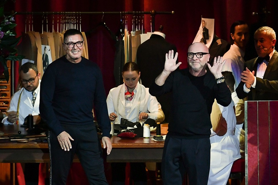 Italian fashion designers Domenico Dolce (right) and Stefano Gabbana acknowledge applause following the presentation of their Men's autumn-winter 2019/20 fashion show in Milan. Photo: AFP