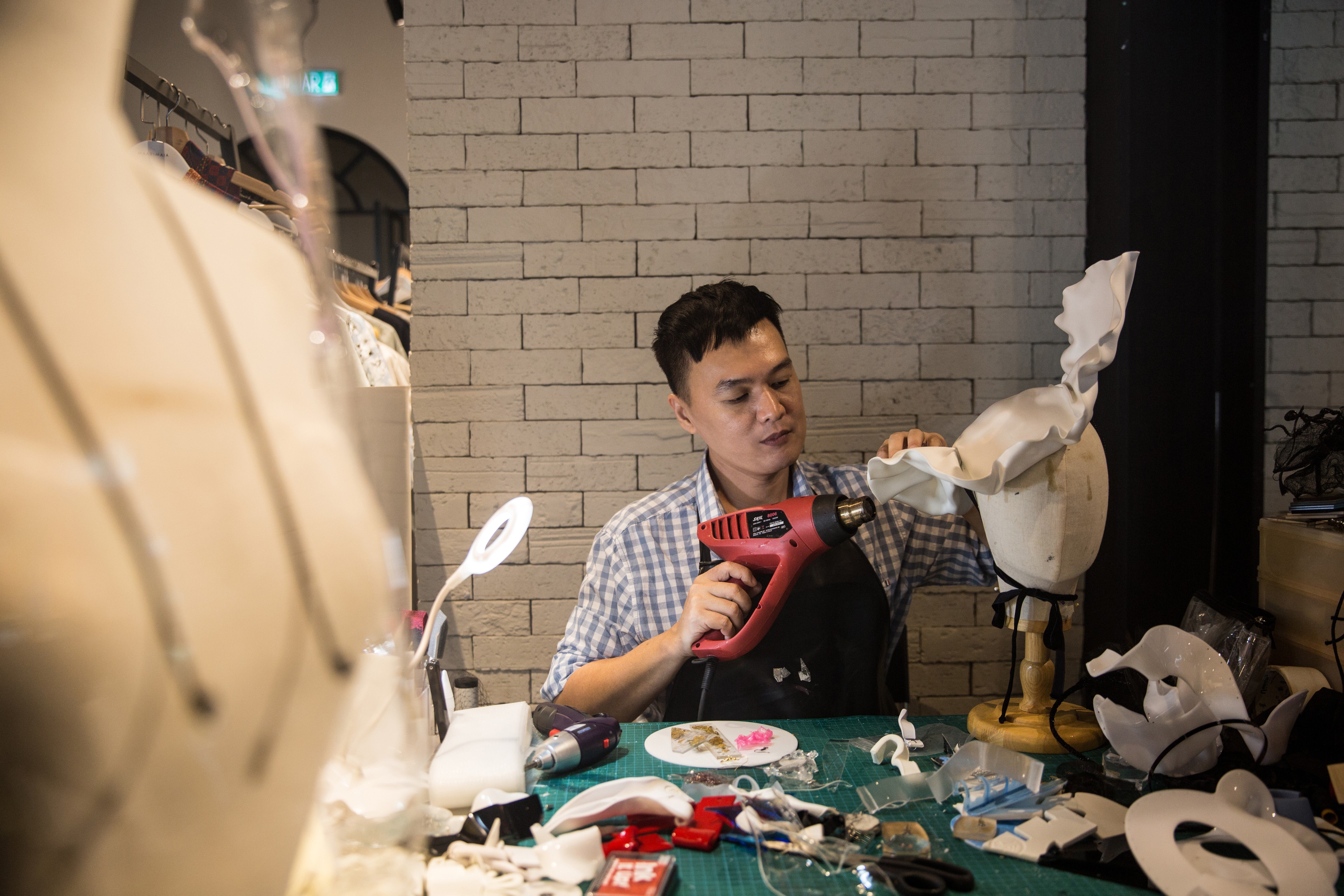 Malaysian milliner Bremen Wong in his atelier.