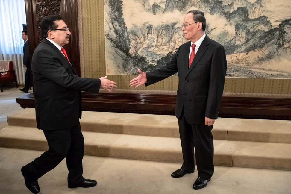 Chinese Vice-President Wang Qishan shakes hands with Medardo Gonzalez, secretary general of the ruling party of El Salvador, during their meeting in Beijing on August 21, 2018. El Salvador’s switching of relations from Taipei to Beijing in 2018 alarmed Washington. Photo: Reuters