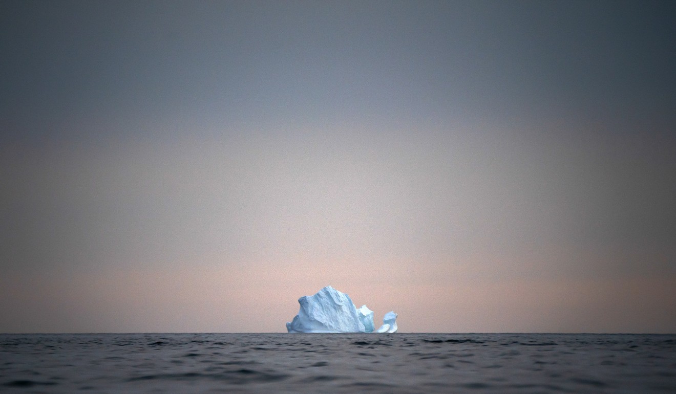 A large Iceberg floats away as the sun sets near Kulusuk, Greenland. The changing climate, along with increased interest in regional resources from China, Russia and the US has increased attention on the large but sparsely populated island. Photo: AP