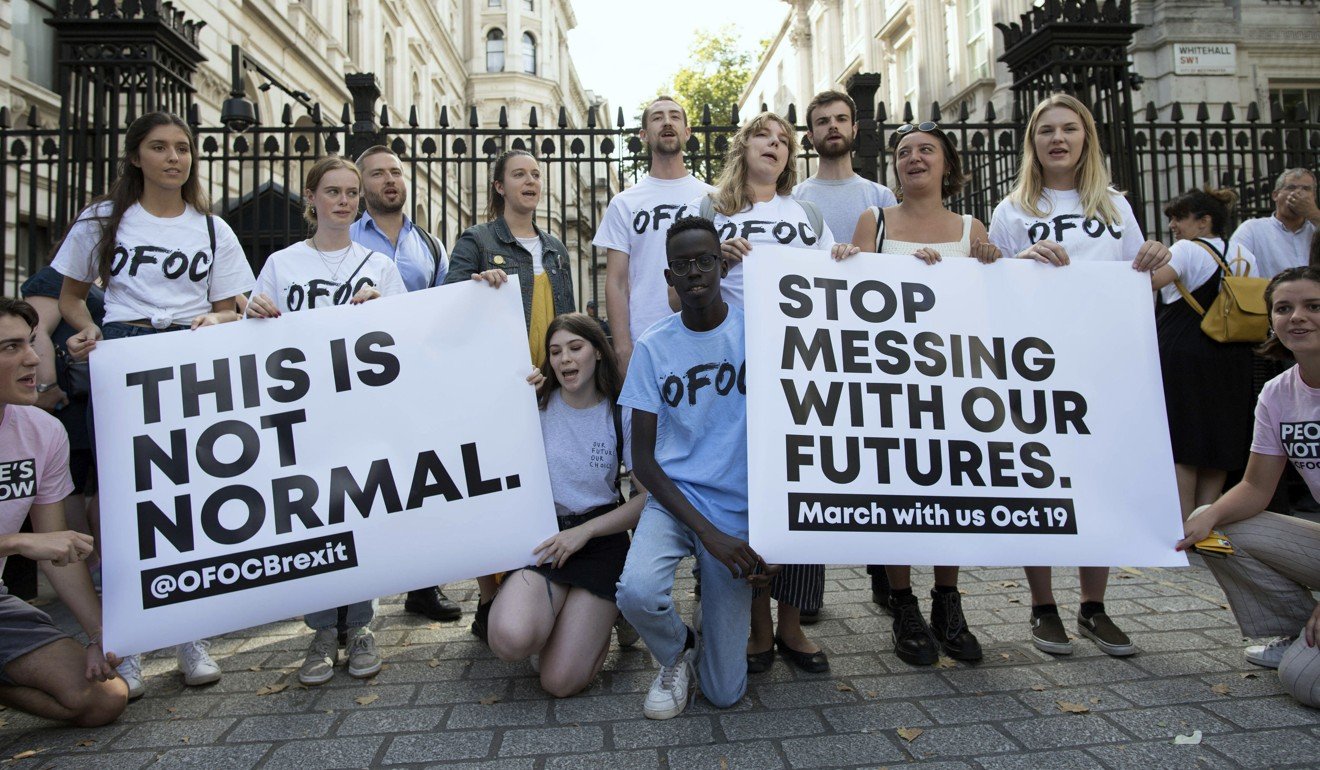 Young protesters rally outside Downing Street in London. Photo: AP