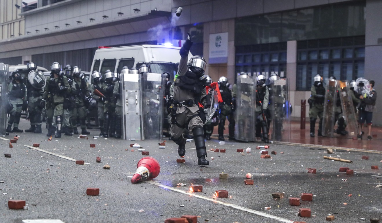 Police throw a tear gas grenade during a clash with anti-government protesters in Tsuen Wan, on Sunday. Photo: Edmond So