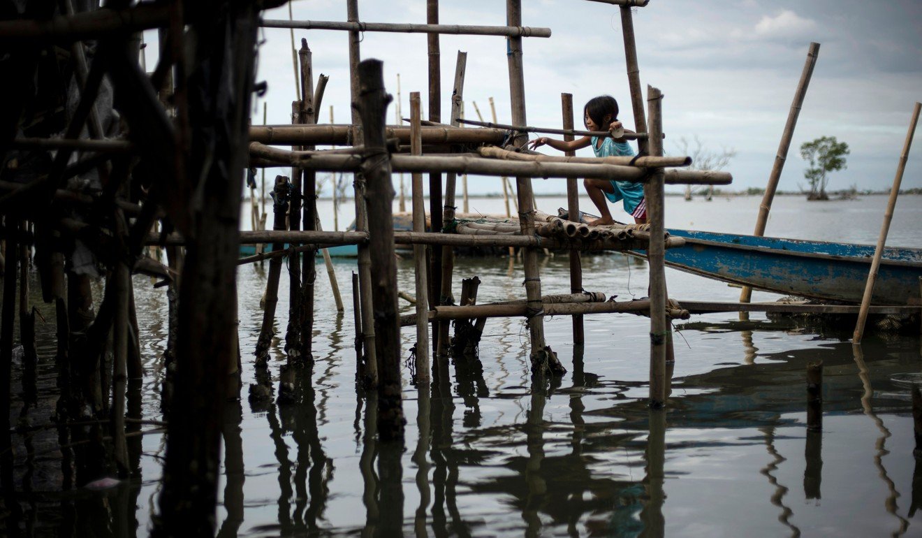 Philippine coastal towns face disaster as ground sinks while sea levels ...