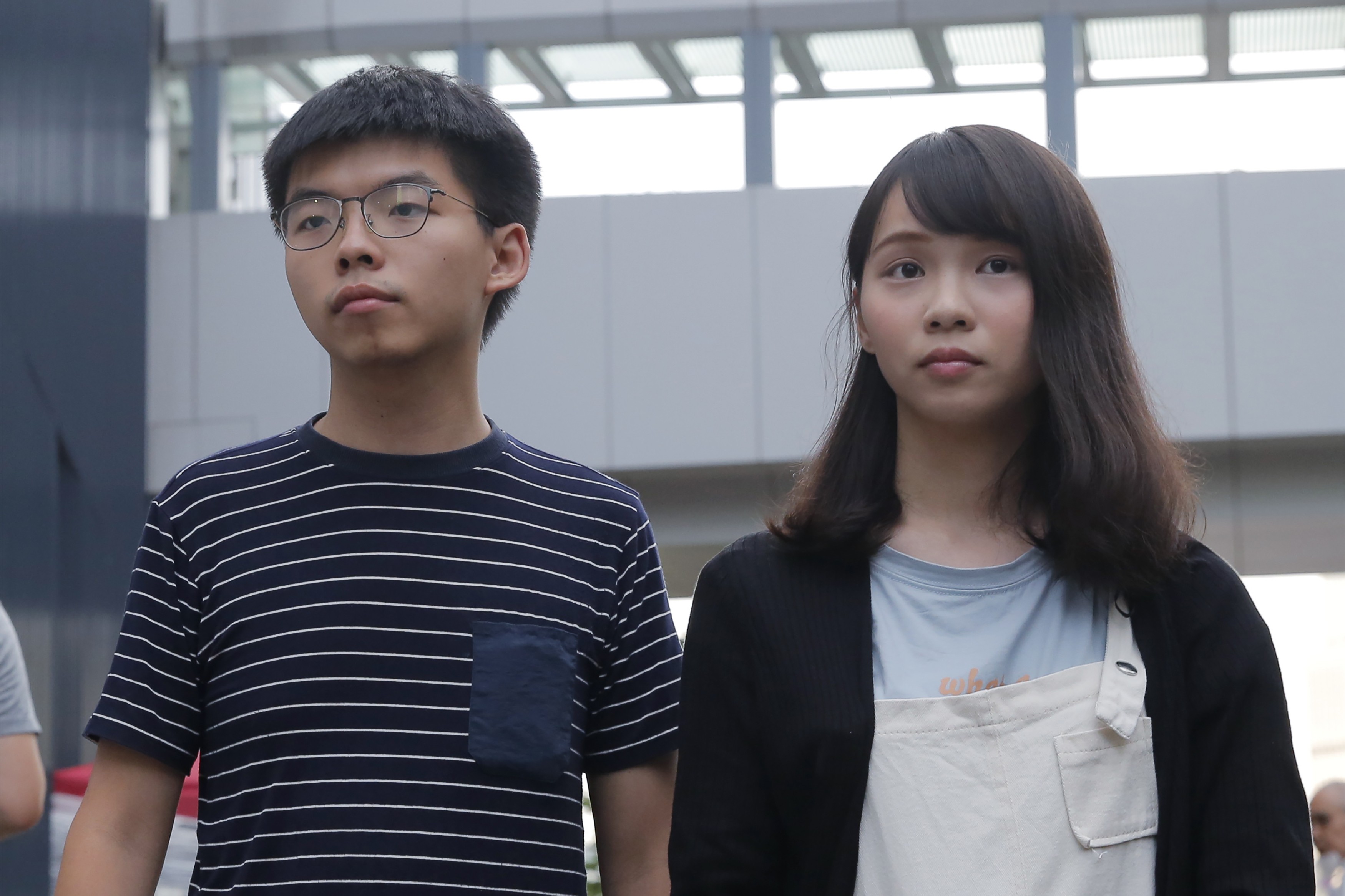 Joshua Wong and Agnes Chow are among a trio of activists arrested for their alleged roles in anti-government protests since June. Photo: AP