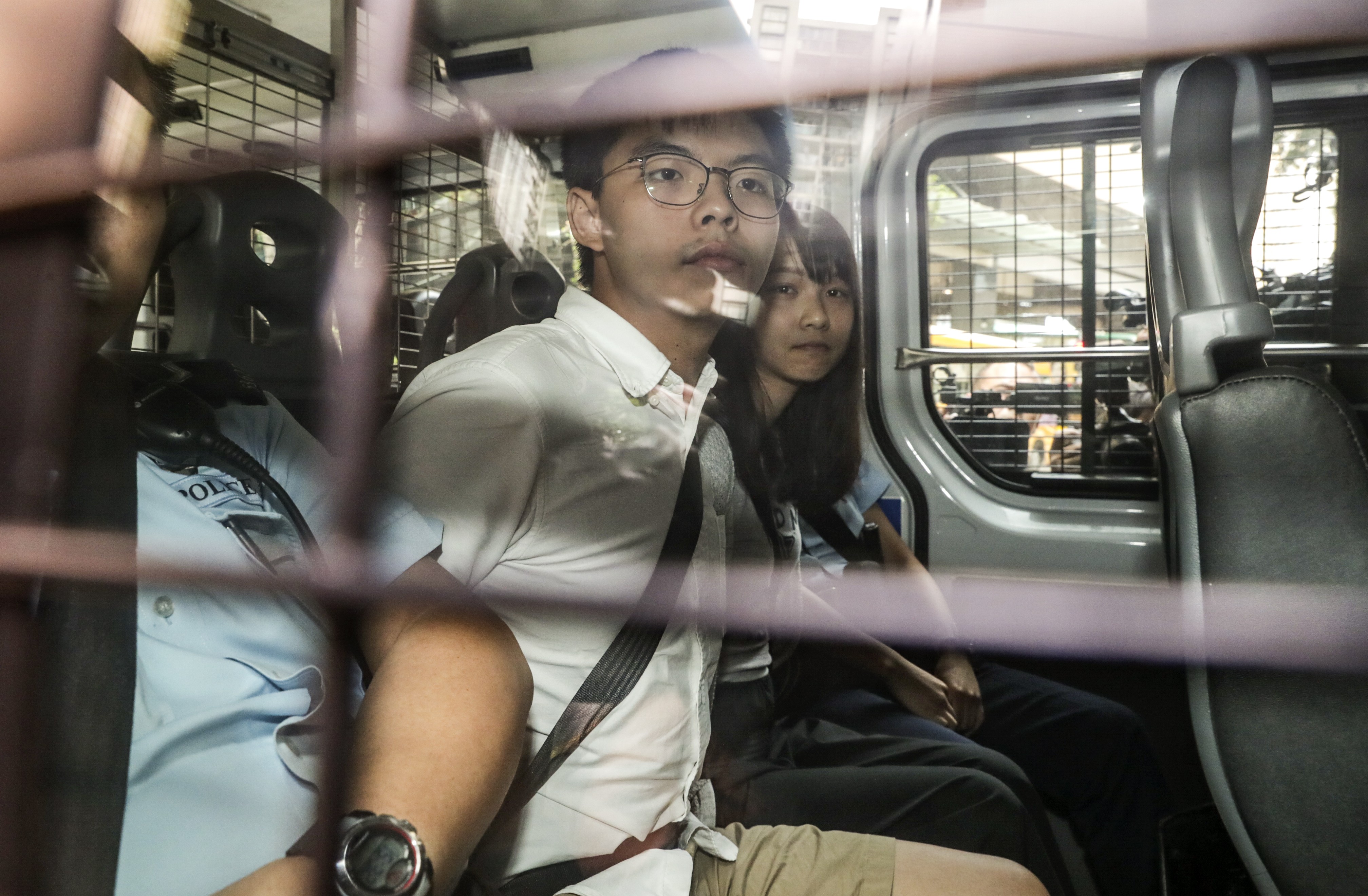 Joshua Wong and Agnes Chow were detained on a number of charges. Photo: Edmond So