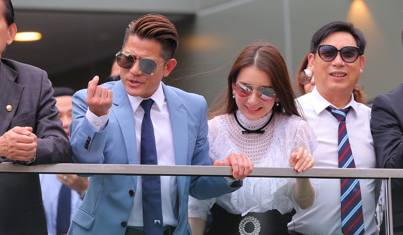 Super star Aaron Kwok watches his horse Dancing Fighter run second at Sha Tin.