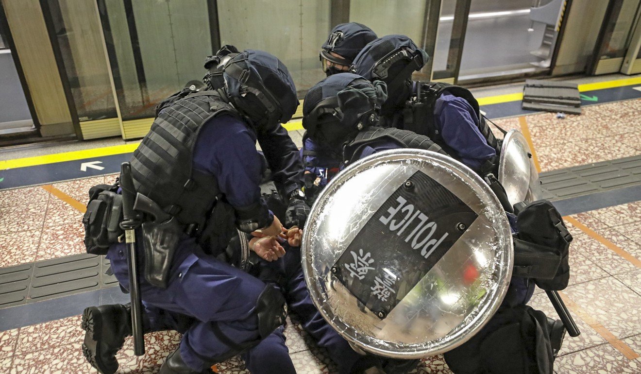 Riot police arrest an anti-government protester in Prince Edward MTR Station. Photo: Handout