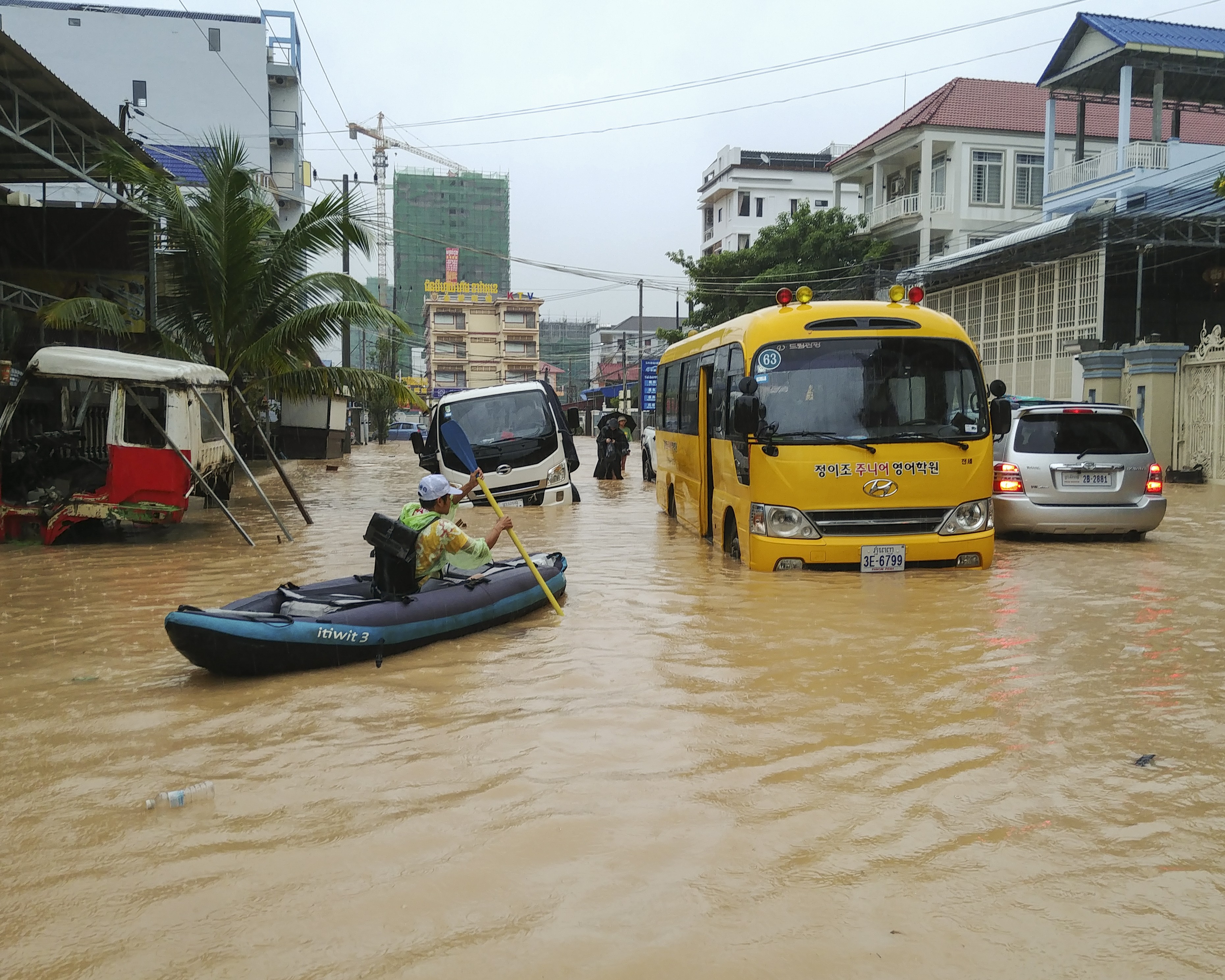 Submerged cars, buses and motorbikes were abandoned throughout the city during heavy flooding in Sihanoukville, Cambodia, early last month. Photo: Mother Nature