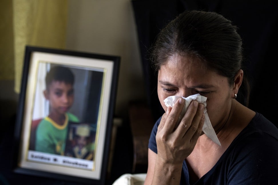 Lilia Alcabasa, whose 12-year-old son, Leiden, died after he was treated with anti-dengue fever vaccine Dengvaxia, in her home in Calamba, Laguna, south of Manila.