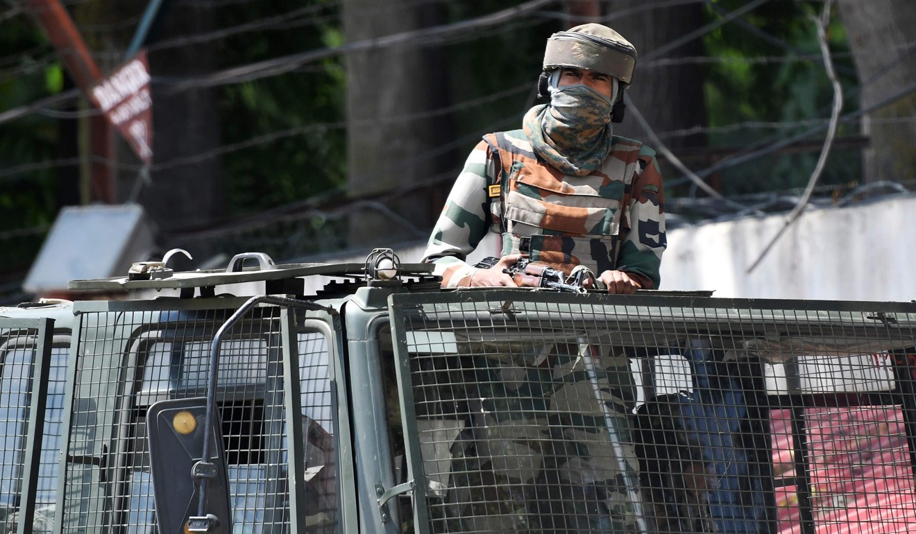 An Indian soldier in a truck in Srinagar. Photo: AFP