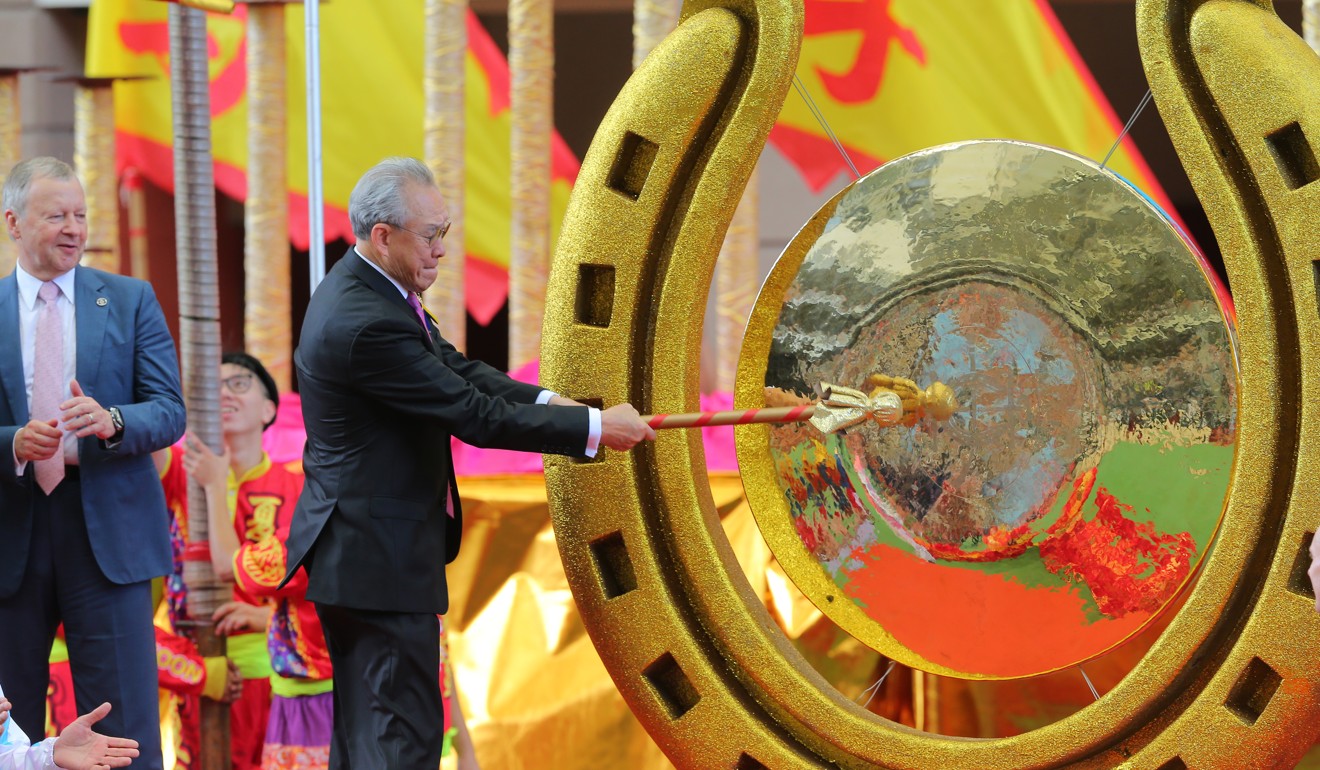 Jockey Club chairman Anthony Chow opens the racing season by striking a gong.