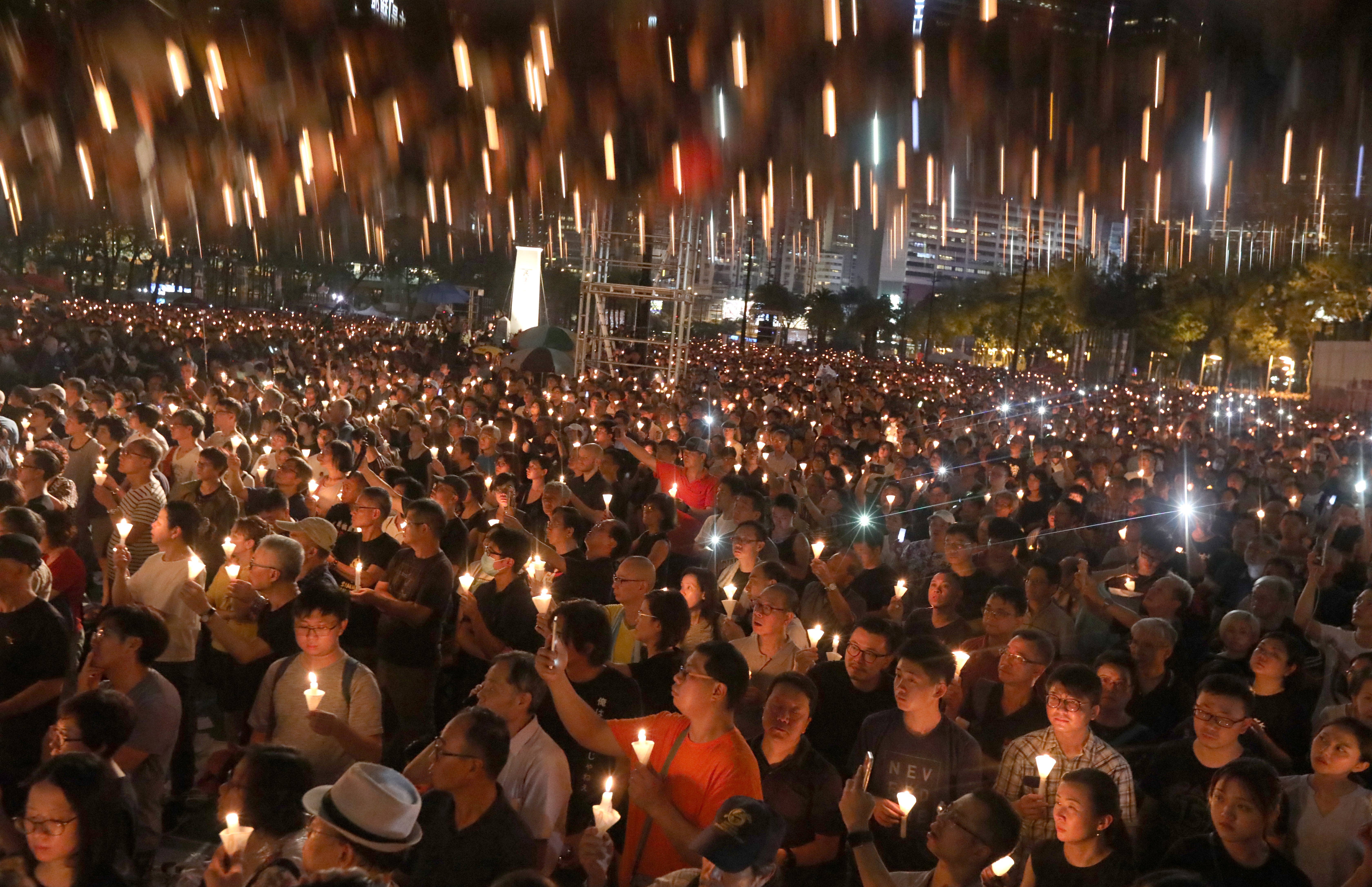People raise their candles during a vigil at Victoria Park in Causeway Bay on June 4 to commemorate the 30th anniversary of the Tiananmen Square crackdown. Photo: Felix Wong