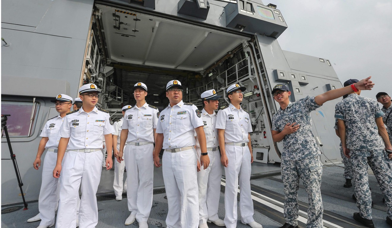 Chinese sailors (left) visit Singapore navy’s frigate RSS Stalwart during the Asean-China Maritime Exercise in Guangdong province last year. Photo: AFP