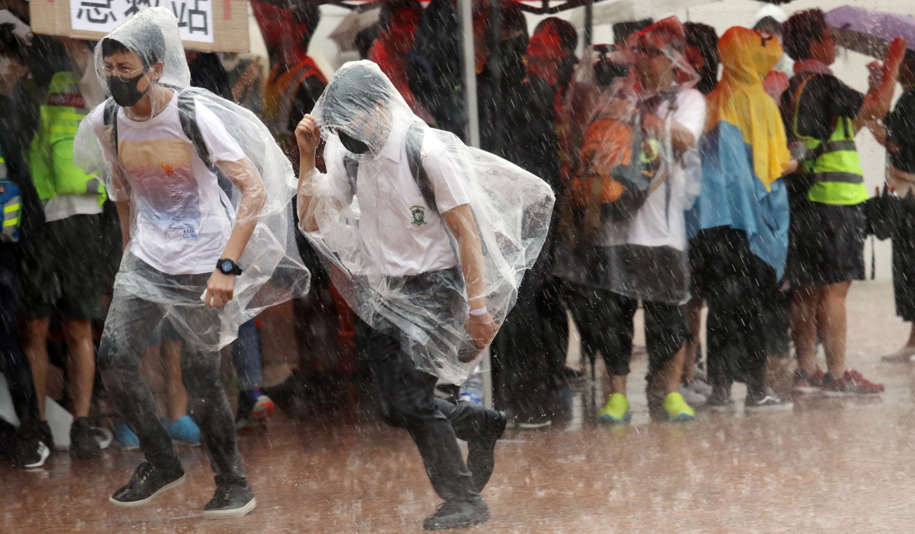 The event was interrupted for 10 minutes by torrential rain. Photo: Nora Tam