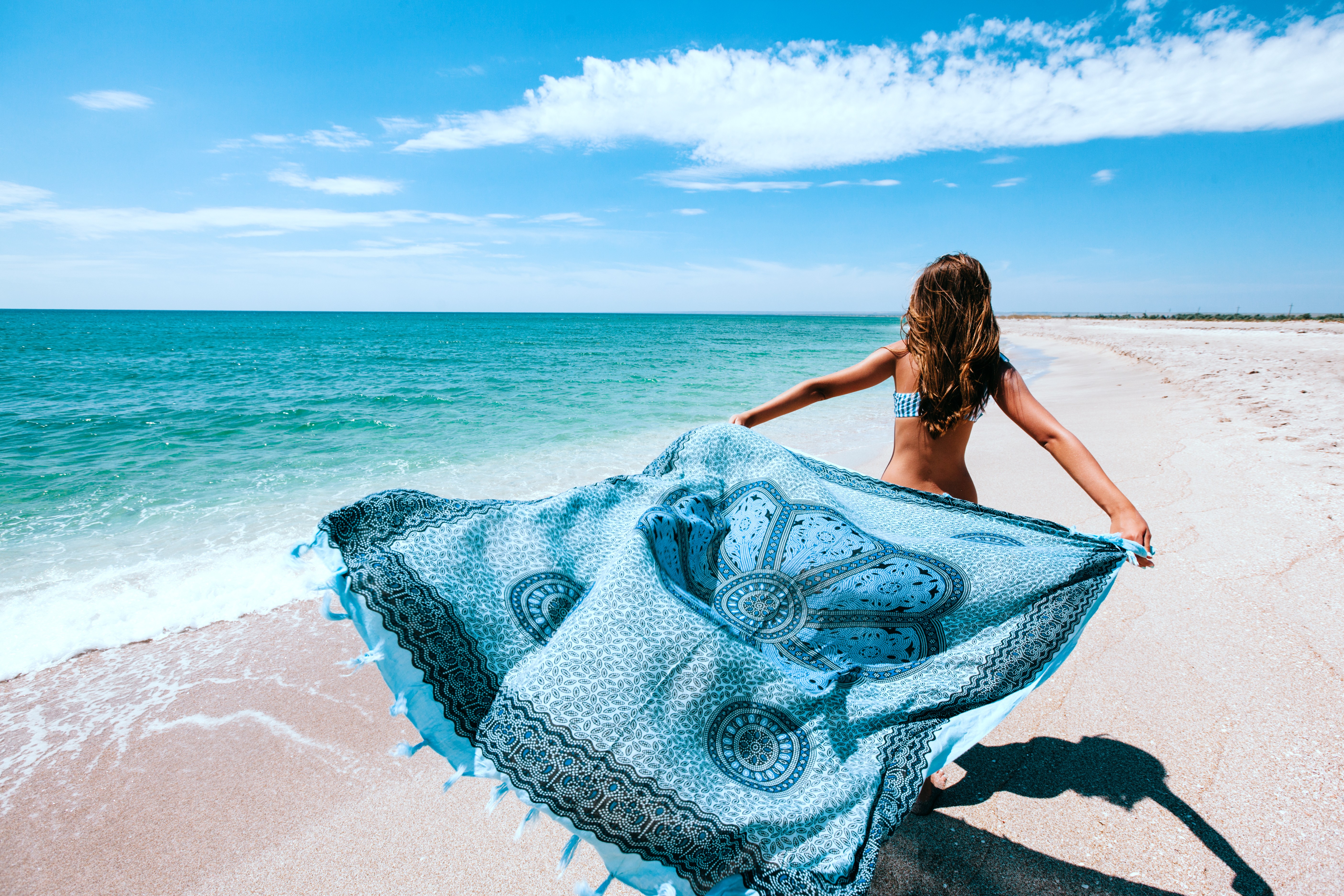 More flattering than a kaftan, sarongs can hide a multitude of sins and help draw attention to the bits we don’t mind showing off. Photo: Shutterstock