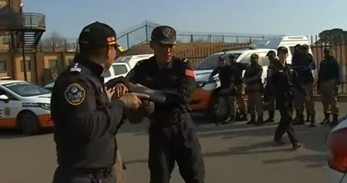 Chinese specialists demonstrate how to restrain a suspect. Photo: YouTube