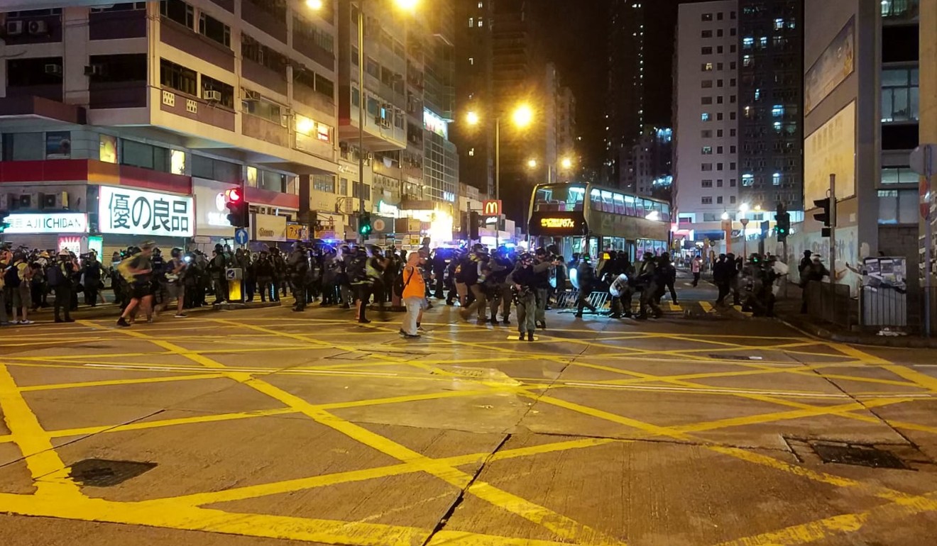 Riot police clearing the roads. Photo: Linda Lew