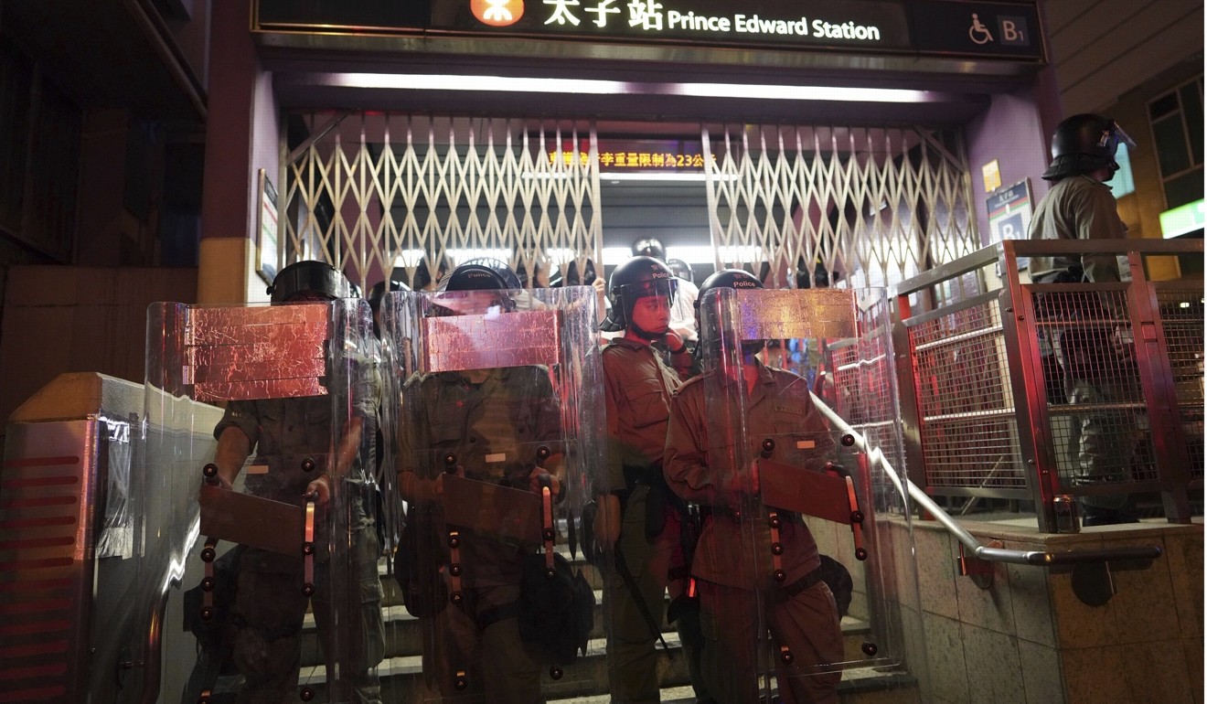 Police stand guard after Prince Edward MTR station is closed. Photo: AP