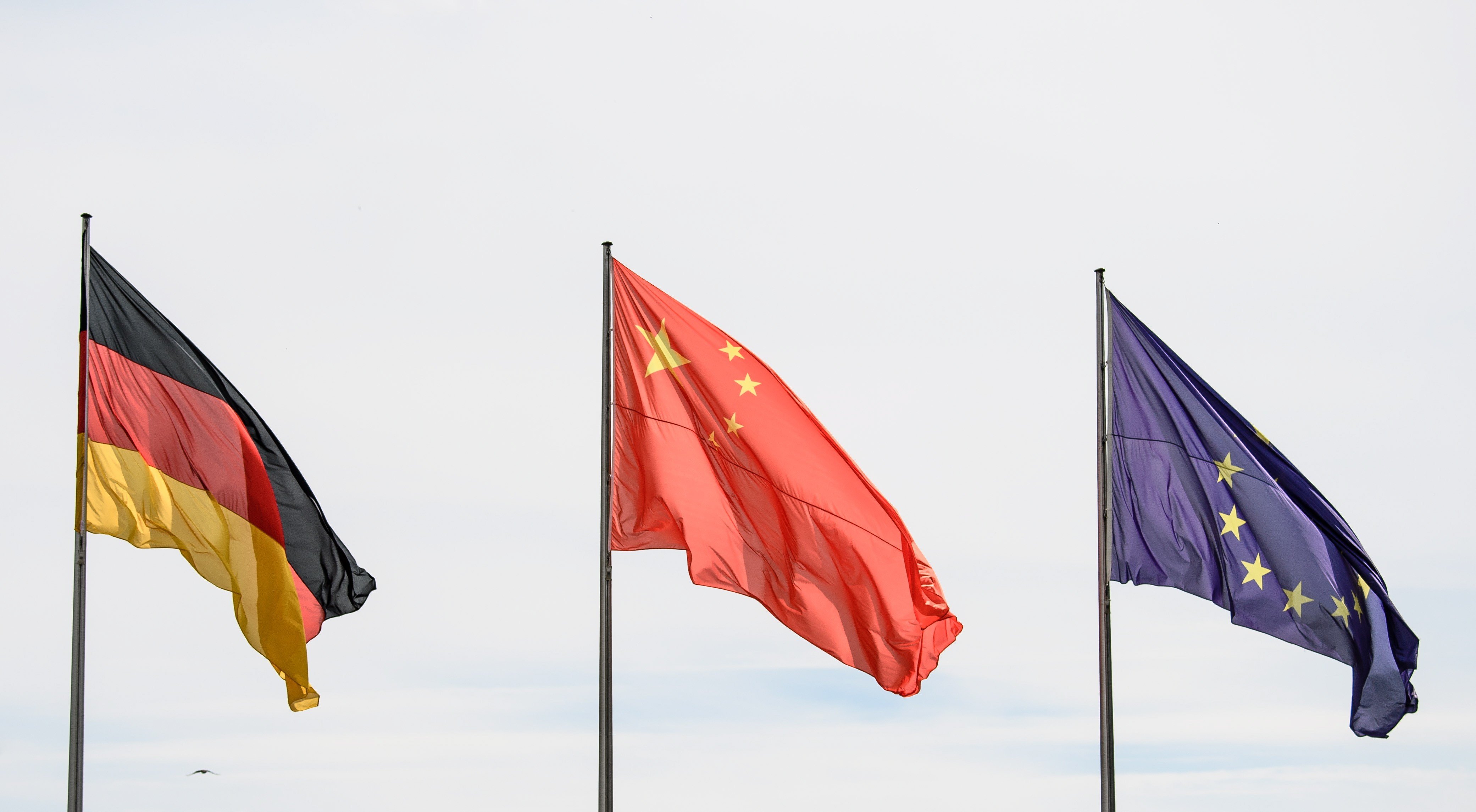 The German, Chinese and EU flags fly in Berlin, Germany, in readiness for German-Chinese bilateral government talks last year. Just as Germany sits at the centre of the EU, China could one day be the leader of a future Asian Union – if it heeds the lessons of history. Photo: EPA-EFE
