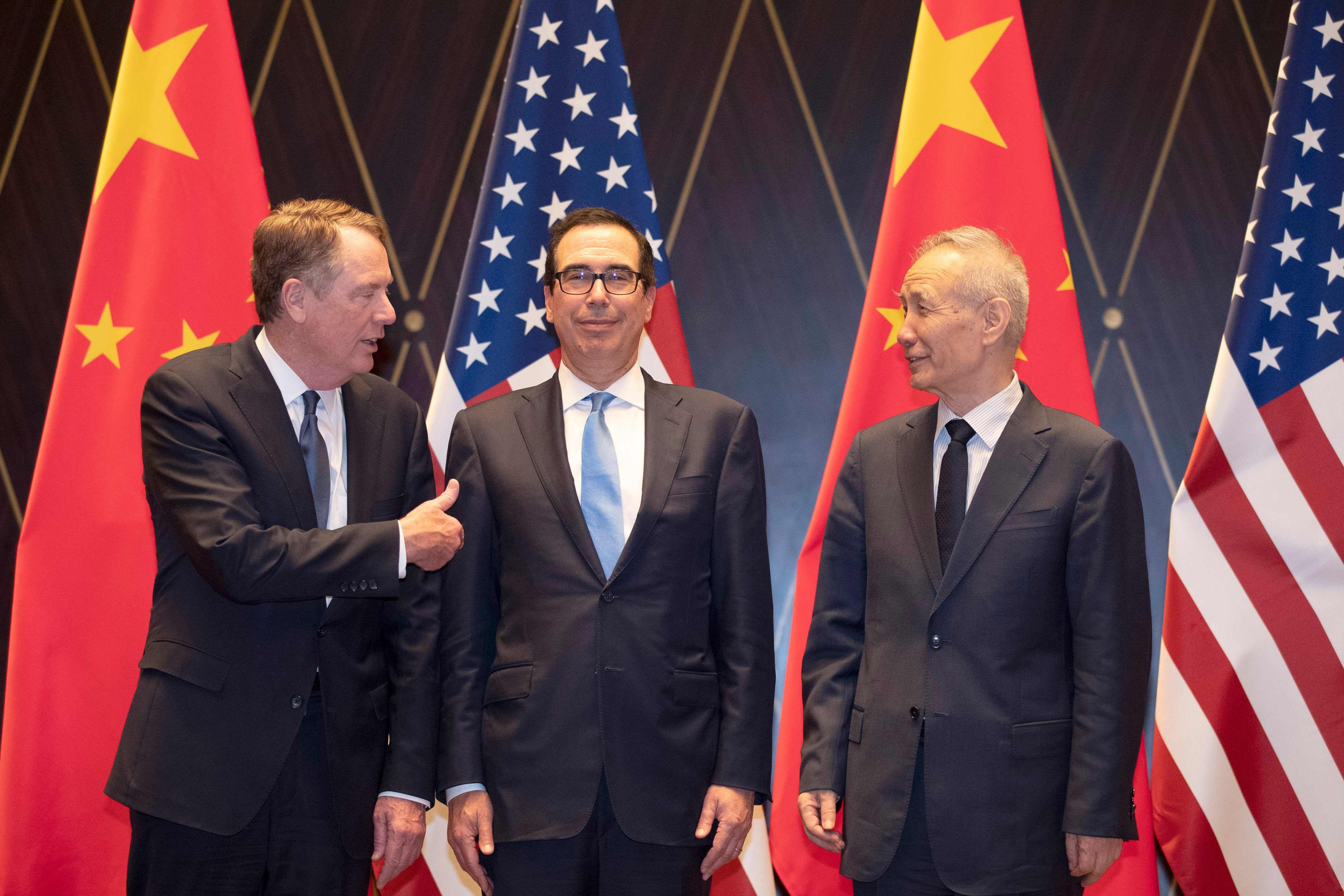 US Trade Representative Robert Lighthizer and US Treasury Secretary Steven Mnuchin pose for a photo with Chinese Vice-Premier Liu He in Shanghai on July 31. Within 48 hours of this picture, when progress in negotiations was apparent, the trade war between the US and China escalated with the announcement of fresh tariffs. Photo: AFP